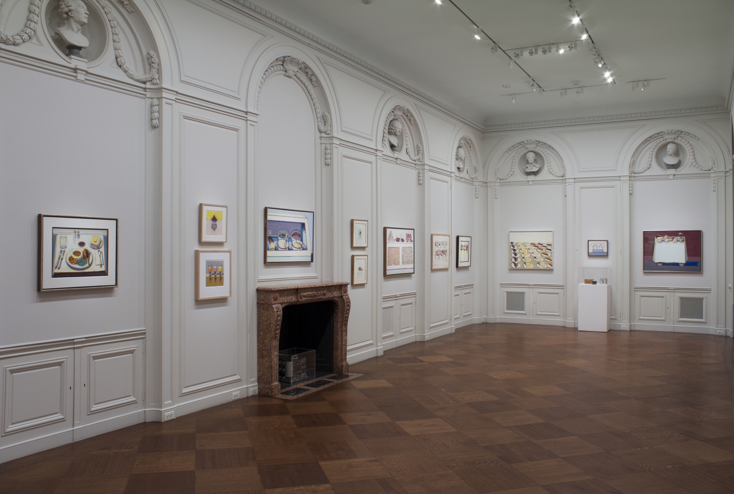 Installation view of&nbsp;Wayne Thiebaud: A Retrospective,&nbsp;October 22&ndash;November 29, 2012.&nbsp;Left to Right:&nbsp;Drumstick Dinner, 2012;&nbsp;Cupcake and Shadow, 1995-2012;&nbsp;Drink Syrups, 1964, Lent by Private Collection;&nbsp;Food Bowls, 1992-2005, Lent by Wayne and Betty Jean Thiebaud;&nbsp;Two Flavors, 2003, Lent by Betty Jean Thiebaud;&nbsp;Two Donuts, 2003;&nbsp;Peppermint Counter, 1963, Lent by Wayne and Betty Jean Thiebaud;&nbsp;Big Suckers, 1971;&nbsp;Condiment Bowls, undated;&nbsp;Pie Counter, 1963, Lent by Whitney Museum of American Art, New York; purchase with funds from the Larry Aldrich Foundation Fund (64.11);&nbsp;Lollipops, 1962, Lent by Private Collection;&nbsp;Cafe Cart, 2012, Art&nbsp;&copy; Wayne Thiebaud / Licensed by VAGA at ARS, New York.